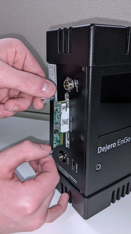 SIM module being inserted