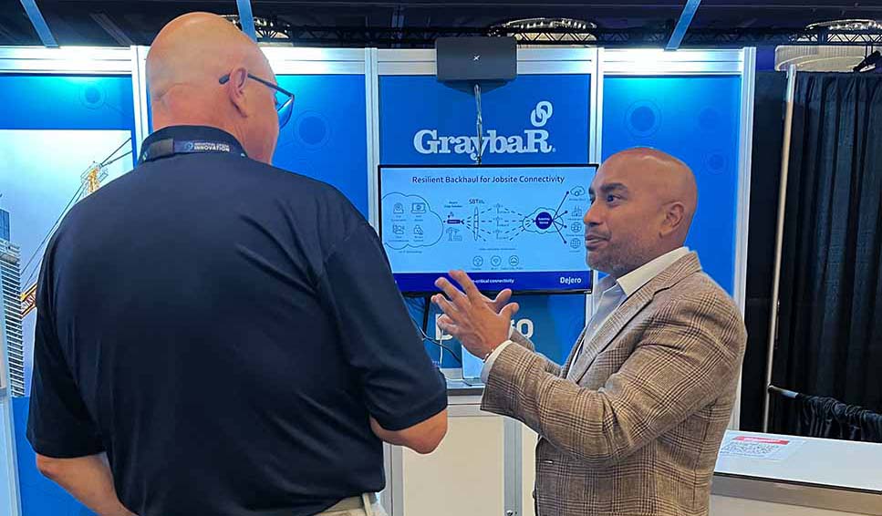 Kevin speaking to a attendee at the Graybar booth