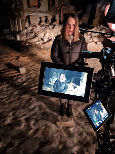 i&u TV news teams in Ukraine using a camera