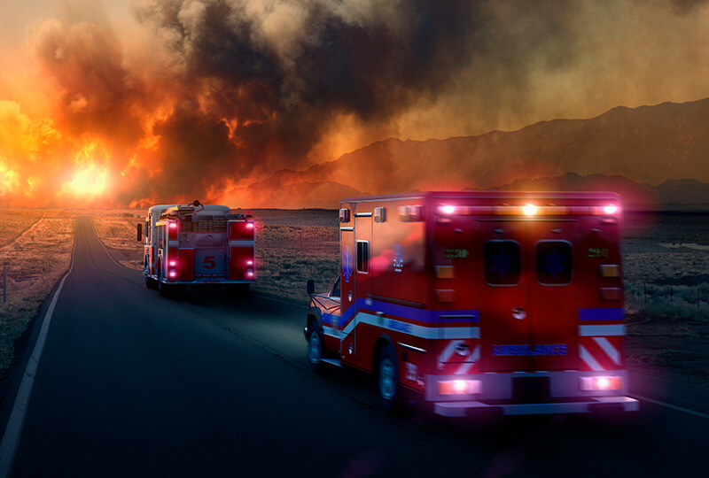 Emergency vehicles going towards a fire