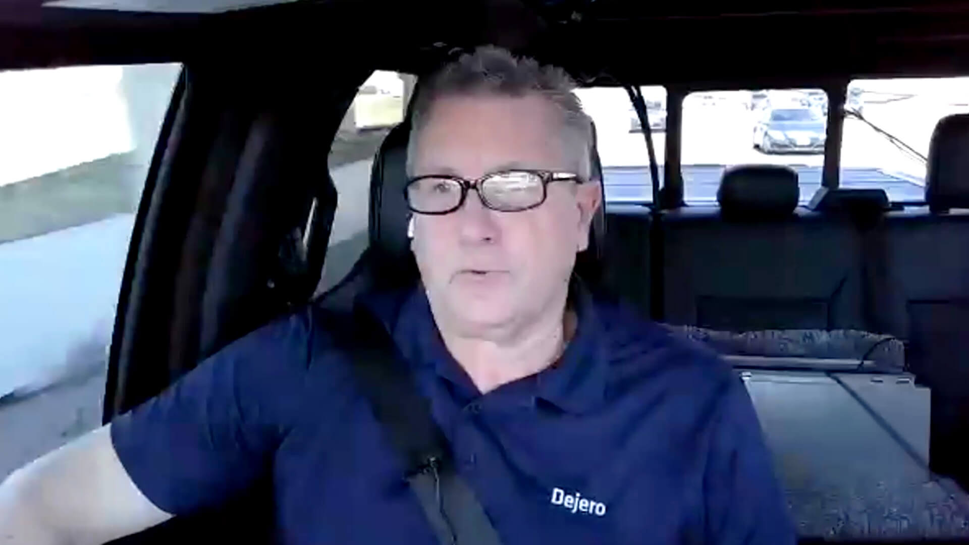 Dean Taylor driving and speaking to a camera