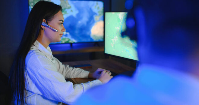 Photo of a successful dispatcher working on a computer in the office.