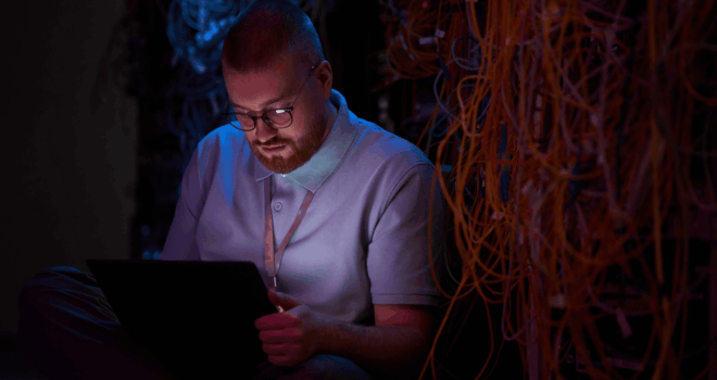 technician setting up network in data center
