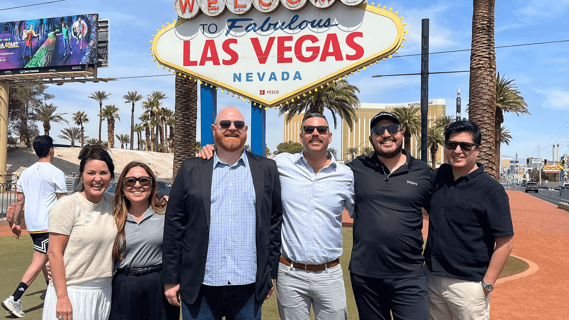 Team shot in front of the famous Welcome to Las Vegas sign
