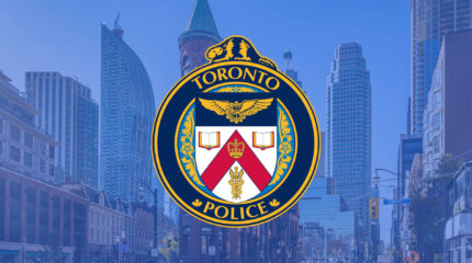 Toronto Police Insignia over a picture of Toronto