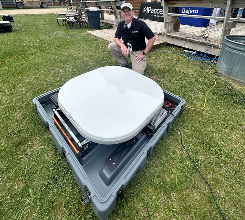 Michael Weaver with IP Access International, showcases the Kymeta antenna used to blend with all other available networks via Dejero Smart Blending Technology.