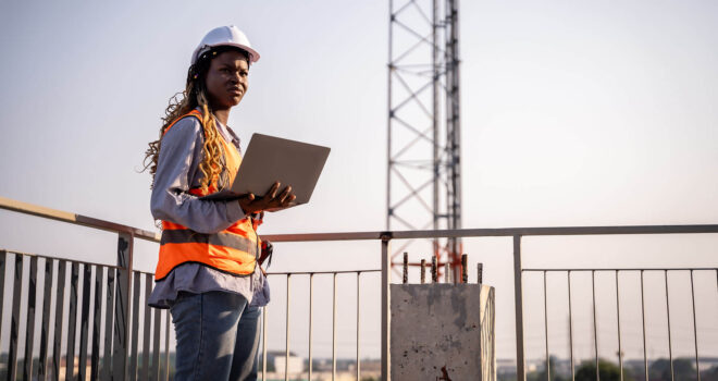 Engineer technician inspects building structure Engineer technicians are looking at and analyzing unfinished construction projects. In order to be in accordance with the design