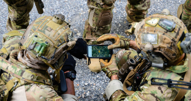 Smart teamwork of soldiers running forward and attacking enemy during military operation, Army soldiers in protective combat uniform, Soldiers with rifle, Soldiers with rifle on world war field. High quality photo
