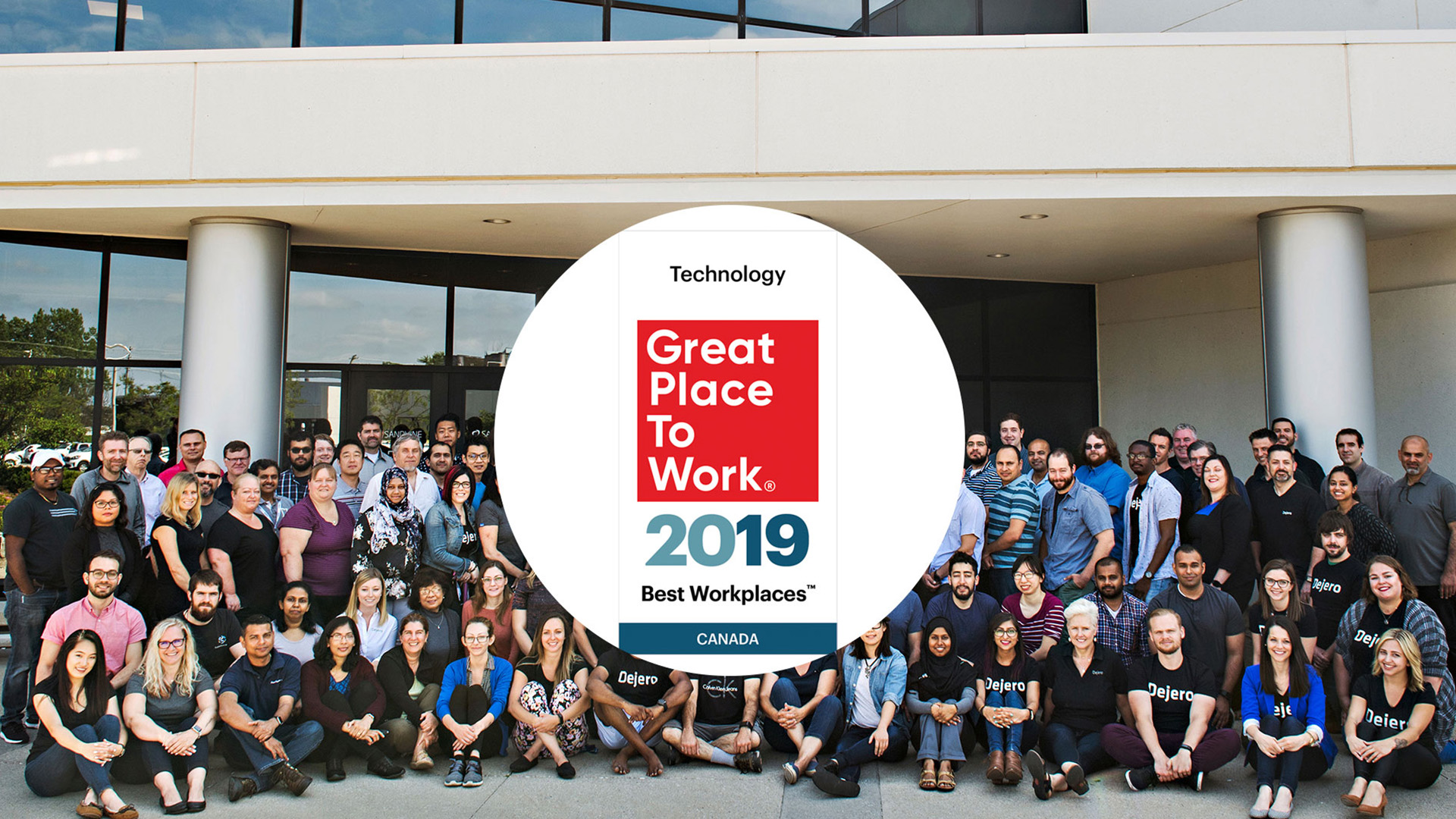 Dejero team with the 2019 award overlayed over the photograph