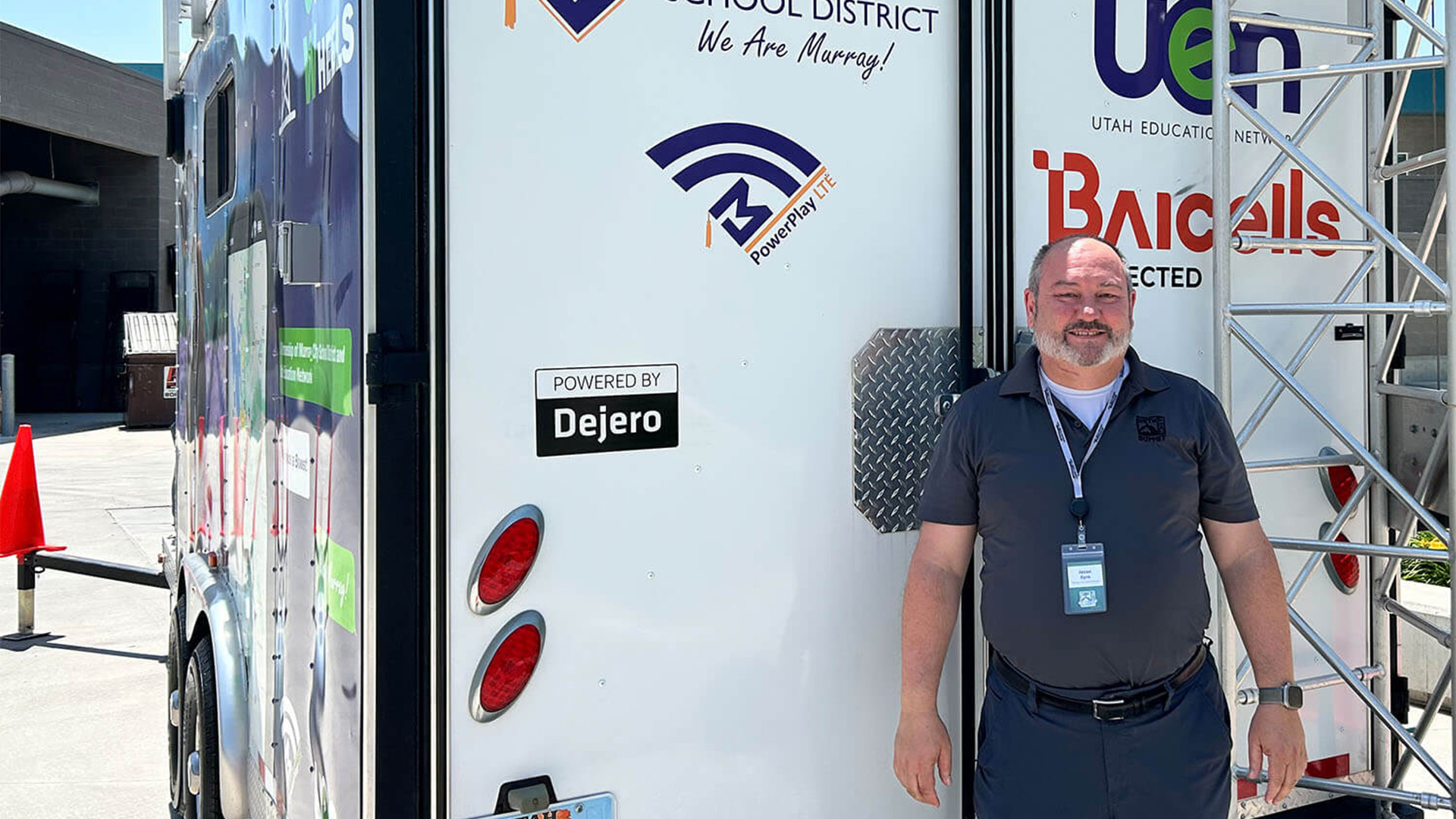 Jason Eyre in front of a trailer
