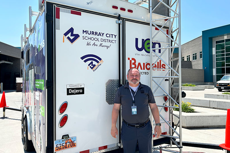 Jason Eyre in front of a trailer
