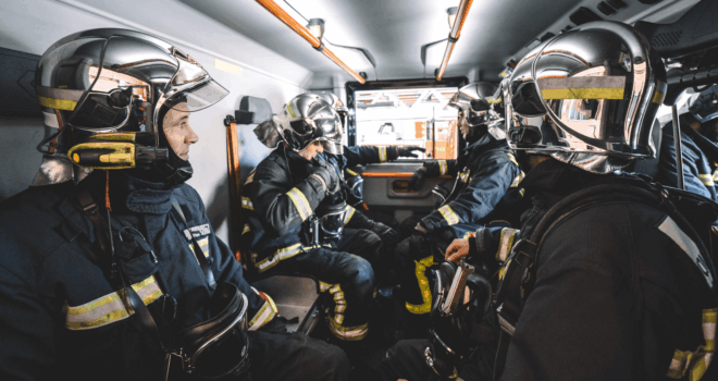 firemen working inside an emergency vehicle