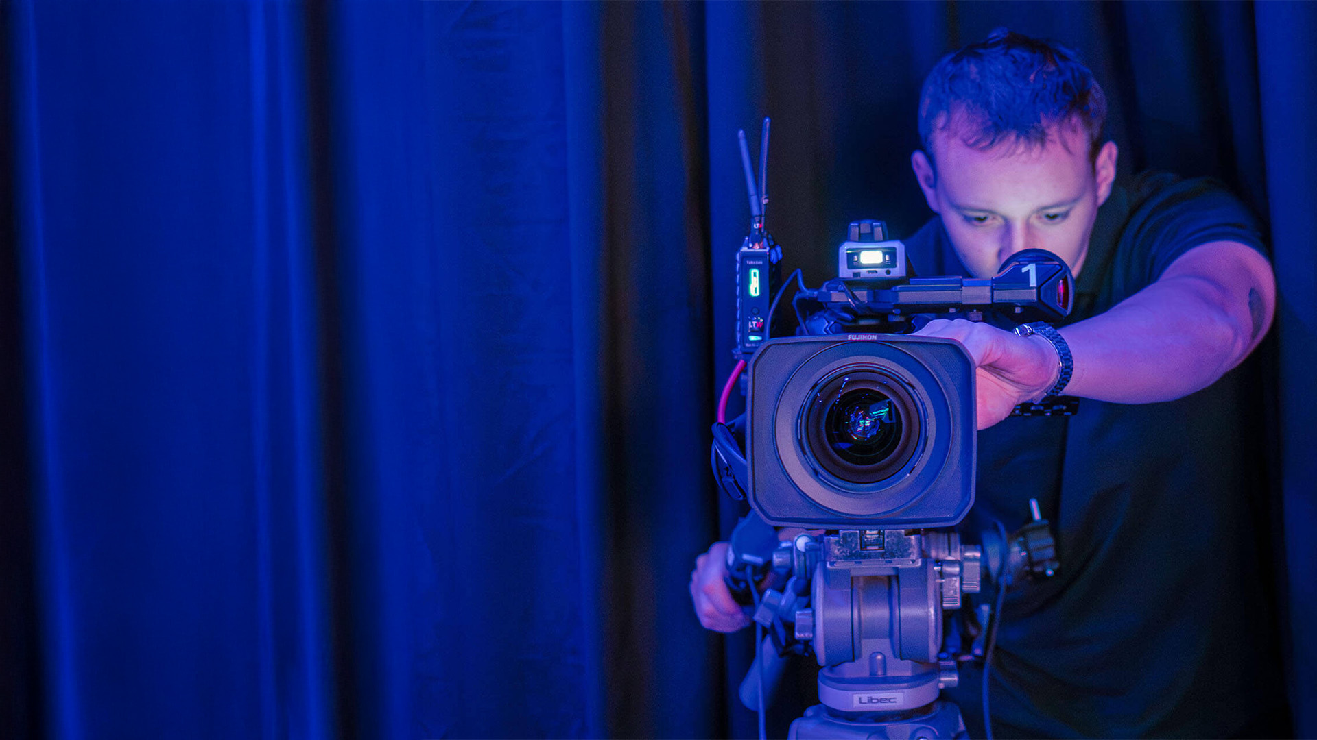 A Stream7 technician adjusts camera settings
