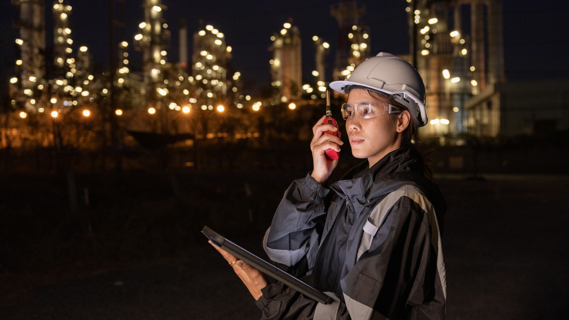 Engineers conducting night inspection at refinery