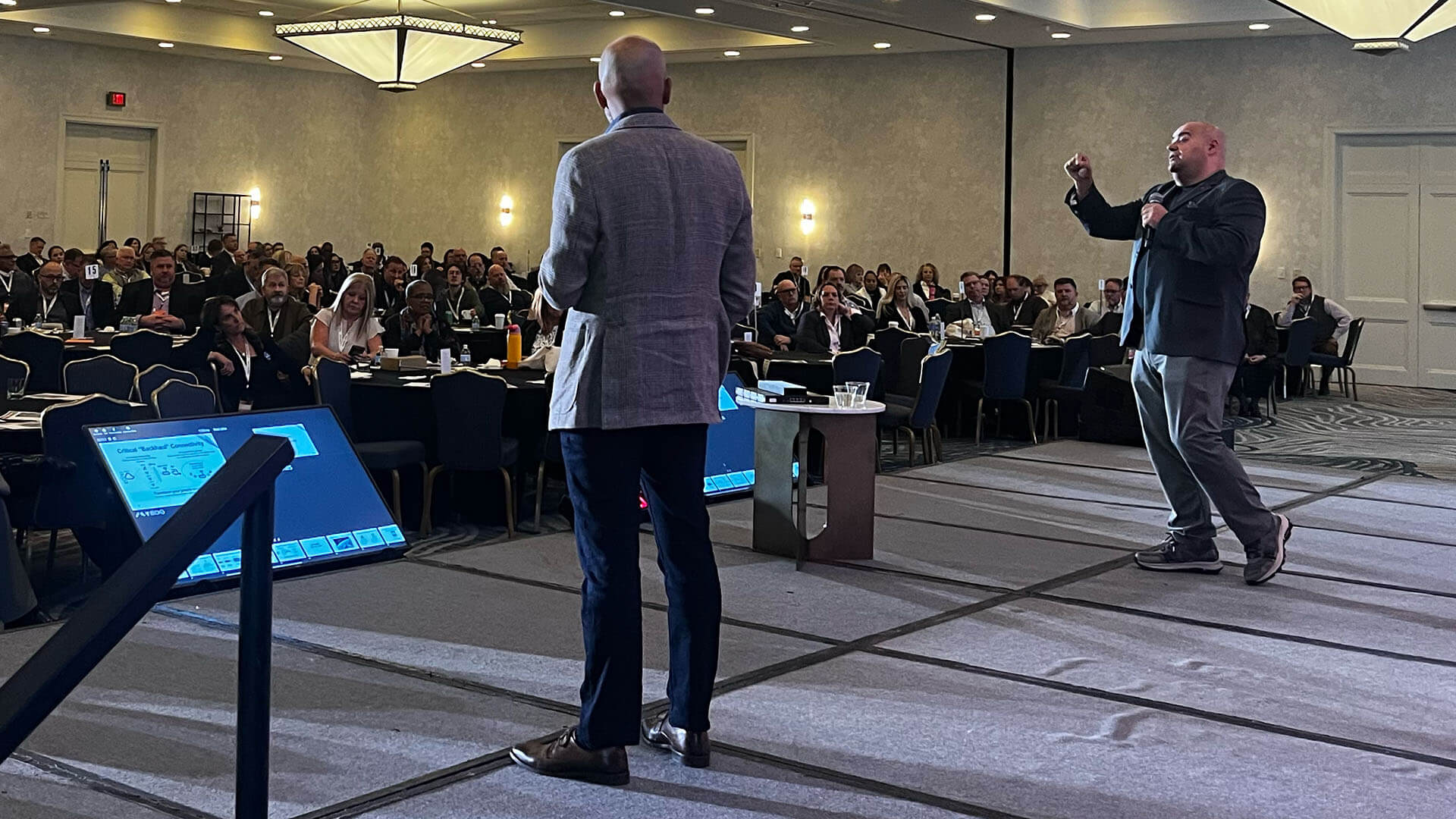 Main stage at the Lumen SKO, Kevin and Bogdan presenting with Kevin speaking