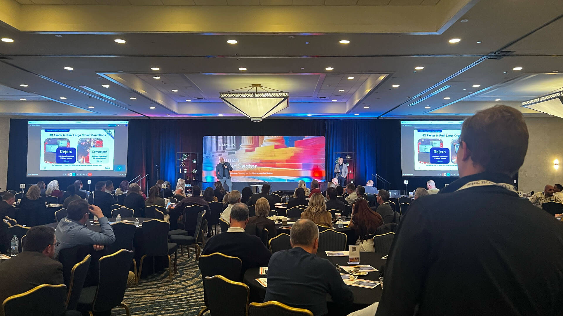 Main stage at the Lumen SKO, Kevin and Bogdan on stage with Bogdan speaking