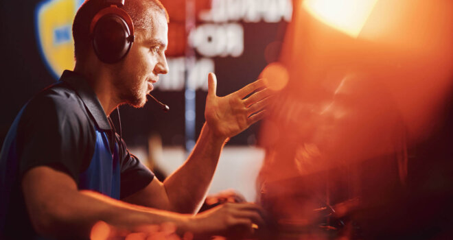 Commentator talking and gesturing with their hands