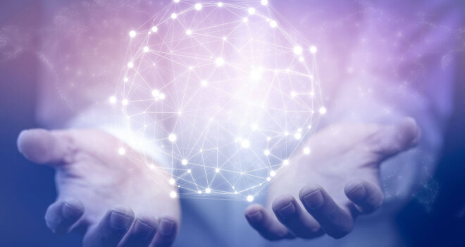 Hands cradling a connectivity sphere