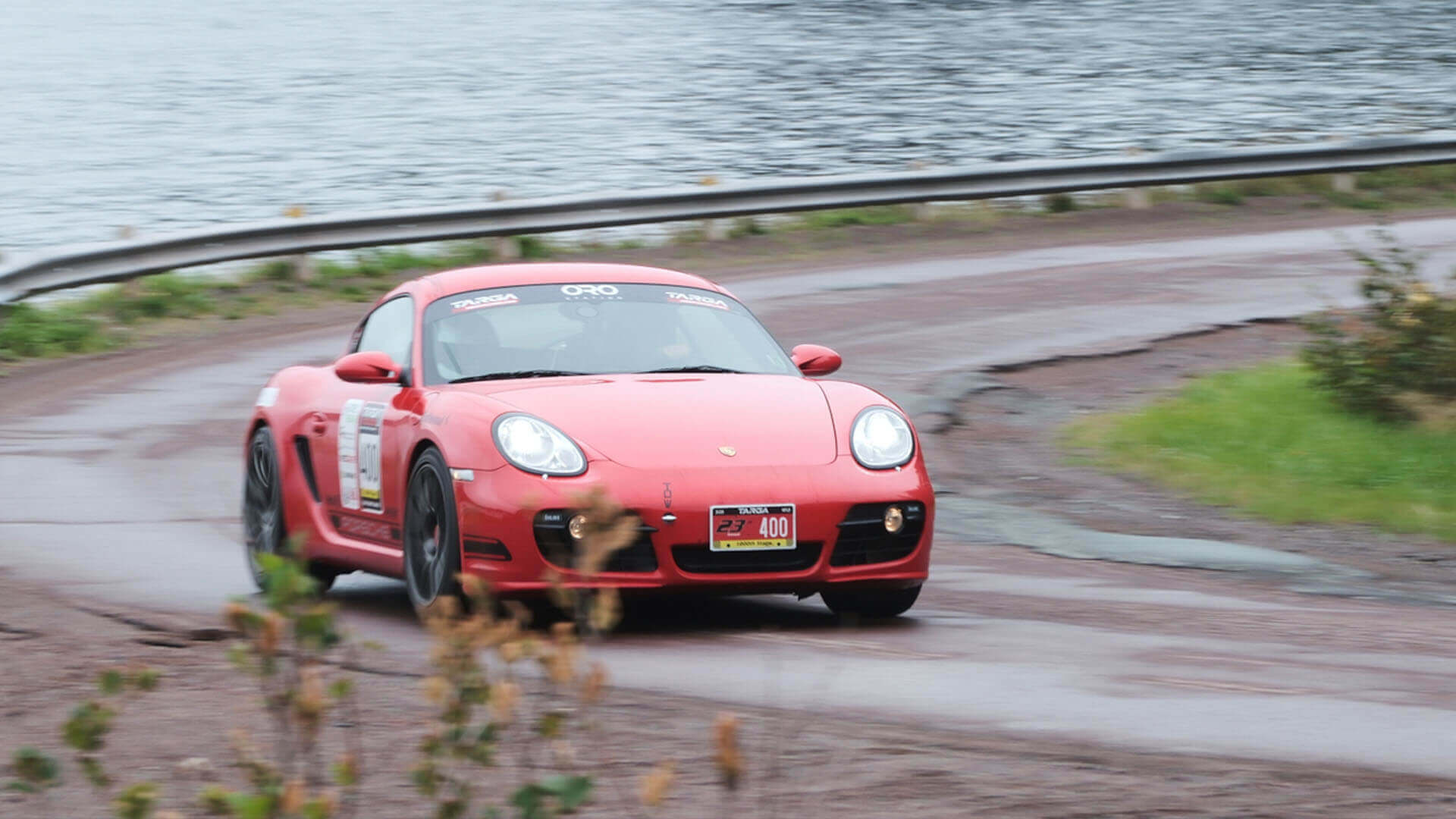 Porsche at a fast speed taking a turn, photographed by Larry Strung