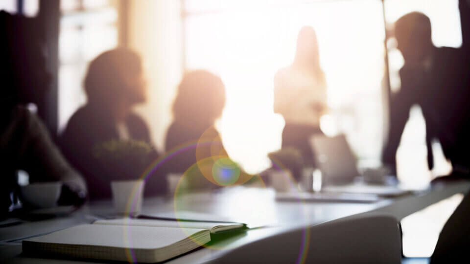Meeting in Bright Room with a Table